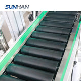 roller conveyor of squeezable tube label applicator for ointment